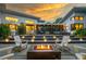 Beautiful backyard space with a fire pit, lounge seating, and a covered patio for outdoor entertaining at 587 47Th St, Sarasota, FL 34234