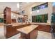Spacious kitchen features modern appliances, an island, and plenty of counter space for cooking and entertaining at 587 47Th St, Sarasota, FL 34234