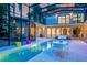 Stunning screened-in pool with attached spa and ample seating, ideal for relaxation and outdoor enjoyment at 587 47Th St, Sarasota, FL 34234
