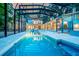 Magnificent pool features a screened enclosure, spa, and lots of deck space for entertaining or lounging at 587 47Th St, Sarasota, FL 34234