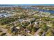 Aerial view of a neighborhood featuring homes, waterways, and a central property at 603 Frances St, Nokomis, FL 34275