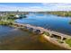 Expansive aerial view of a bridge and community, highlighting the waterfront access and peaceful surroundings at 603 Frances St, Nokomis, FL 34275