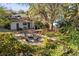Inviting backyard featuring a cozy fire pit and seating area, perfect for outdoor gatherings at 603 Frances St, Nokomis, FL 34275