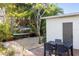 Lush backyard featuring an outdoor patio, and paddle board storage at 603 Frances St, Nokomis, FL 34275