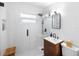 Modern bathroom with glass enclosed shower, floating vanity, and sleek fixtures at 603 Frances St, Nokomis, FL 34275