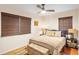 Cozy bedroom with woven shades, ceiling fan, and neutral décor at 603 Frances St, Nokomis, FL 34275