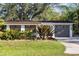 Charming home with lush landscaping and a well-maintained front yard at 603 Frances St, Nokomis, FL 34275