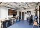 Organized garage featuring a workbench, storage cabinets, and space for parking and hobbies at 603 Frances St, Nokomis, FL 34275