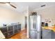 Bright kitchen with stainless steel refrigerator, warm wood counters, and red tile flooring at 603 Frances St, Nokomis, FL 34275