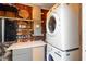 Efficient laundry room with washer, dryer, and a convenient workspace for folding and storage at 603 Frances St, Nokomis, FL 34275