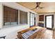 Inviting sunroom with a wooden dining table, stylish barn door, and airy feel at 603 Frances St, Nokomis, FL 34275