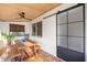 Cozy sunroom with natural lighting, terracotta tile flooring, and wood accents at 603 Frances St, Nokomis, FL 34275