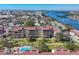 Beautiful aerial view of waterfront condo community with a pool and bay access at 6285 Midnight Pass Rd # 201, Sarasota, FL 34242