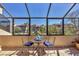 Enclosed balcony offering stunning views of the pool and complex at 6285 Midnight Pass Rd # 201, Sarasota, FL 34242