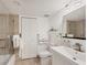 Bright bathroom featuring modern fixtures, a glass-enclosed shower, and neutral tiling at 6285 Midnight Pass Rd # 201, Sarasota, FL 34242