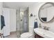 Updated bathroom with a glass-enclosed shower, modern vanity, and neutral color palette at 6285 Midnight Pass Rd # 201, Sarasota, FL 34242
