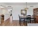 Elegant dining area with stylish table and chairs, flowing seamlessly into the adjacent living spaces at 6285 Midnight Pass Rd # 201, Sarasota, FL 34242