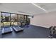 On-site fitness center featuring treadmills, exercise bikes, weights, and flat screen tv at 6285 Midnight Pass Rd # 201, Sarasota, FL 34242