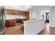 Well-equipped kitchen featuring stainless steel appliances, wood cabinets, and a convenient breakfast bar at 6285 Midnight Pass Rd # 201, Sarasota, FL 34242