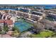 Aerial view of well-maintained community tennis courts with surrounding condos at 6285 Midnight Pass Rd # 201, Sarasota, FL 34242
