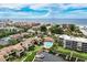 Breathtaking aerial view of the coastal community featuring the pool, docks, and ocean views at 6342 Midnight Pass Rd # 212, Sarasota, FL 34242