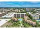 Luxury condo complex with lush landscaping, sparkling pool, and convenient beach access at 6342 Midnight Pass Rd # 212, Sarasota, FL 34242