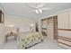 Bright bedroom featuring overhead fan and abundant closet space offers ample storage solutions at 6342 Midnight Pass Rd # 212, Sarasota, FL 34242