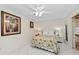 Bright bedroom with overhead fan and tropical decor provides a serene and relaxing ambiance at 6342 Midnight Pass Rd # 212, Sarasota, FL 34242