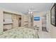 Bright bedroom with overhead fan and en-suite bathroom with direct access to an en-suite bathroom at 6342 Midnight Pass Rd # 212, Sarasota, FL 34242