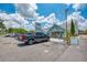 Outdoor view of a boat rental business with parking, boat displays, and signage at 6342 Midnight Pass Rd # 212, Sarasota, FL 34242