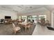 Bright common room with tile floors, ample seating, and large windows for abundant natural light at 6342 Midnight Pass Rd # 212, Sarasota, FL 34242