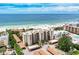 Stunning beachfront condo building with pristine white sand and turquoise ocean views at 6342 Midnight Pass Rd # 212, Sarasota, FL 34242