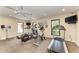 Community gym featuring treadmills, bikes, and a water cooler at 6342 Midnight Pass Rd # 212, Sarasota, FL 34242