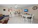 Open-concept living area with dining space and kitchen access, perfect for entertaining at 6342 Midnight Pass Rd # 212, Sarasota, FL 34242