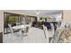 Inviting living space with an adjacent dining area, comfortable seating and access to a large patio at 6342 Midnight Pass Rd # 212, Sarasota, FL 34242