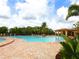 Spacious community pool with ample seating, landscaping and an inviting atmosphere for residents at 6638 Willowshire Way, Bradenton, FL 34212