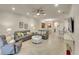 Bright and airy living room with modern furnishings, neutral tones, and ample natural light at 6638 Willowshire Way, Bradenton, FL 34212