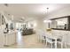 Open-concept living space with dining area, kitchen, and comfortable seating with lots of light at 6638 Willowshire Way, Bradenton, FL 34212