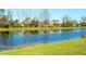 Tranquil pond view providing a peaceful backyard and relaxing view from the home at 6638 Willowshire Way, Bradenton, FL 34212