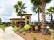 A well-maintained tennis center featuring clubhouse and lush landscaping at 6638 Willowshire Way, Bradenton, FL 34212