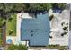 An aerial view showcases a home featuring a backyard with a stock tank pool and a fire pit at 6731 Northampton Pl, Bradenton, FL 34207