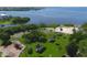 Community aerial view showcases lush greenery, beach access, playgrounds, and waterfront views at 6731 Northampton Pl, Bradenton, FL 34207