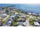 Scenic aerial view of a waterfront community featuring beautiful homes, lush landscaping, and stunning water views at 6731 Northampton Pl, Bradenton, FL 34207