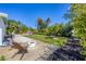Well maintained backyard features a fire pit, stock tank pool, landscaping, and a lawn at 6731 Northampton Pl, Bradenton, FL 34207