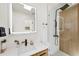 Modern bathroom features wood accents, floating vanity with sink, and glass enclosed shower stall at 6731 Northampton Pl, Bradenton, FL 34207