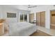 Bright bedroom with slider access to back yard, ceiling fan, minimalist decor and built-in closets at 6731 Northampton Pl, Bradenton, FL 34207