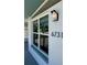 Close-up showcasing a well-lit window and exterior house details with the address number at 6731 Northampton Pl, Bradenton, FL 34207