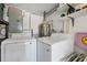 A utility room features a washer and dryer and storage space at 6731 Northampton Pl, Bradenton, FL 34207