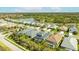 Aerial view of this neighborhood featuring well-maintained homes and scenic lake views at 7012 White Willow Ct, Sarasota, FL 34243