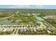 An aerial view of the neighborhood showcasing the lovely homes and serene lakes in this community at 7012 White Willow Ct, Sarasota, FL 34243